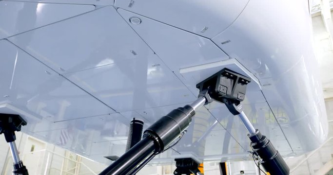 Airliner Flight Simulator In Motion. Actuators Moving Close Up Shot