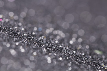 Silver glitter texture close up macro. Abstract sparkle background.