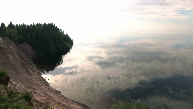 Beautiful view of the lake and the steep coast . The surface of the water.