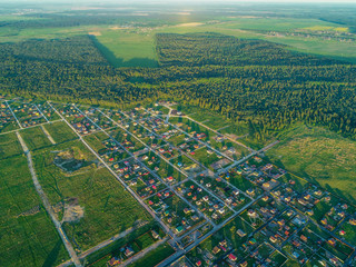 view from the height of the cottage village at sunset Russia