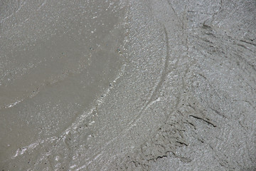 trowel swirls in wet concrete, close-up