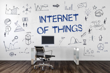 INTERNET OF THINGS Desk in an office with symbols