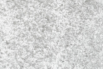 Rough Concrete Wall Decoration, Painted White. White Concrete Wall with Many Protruding Stones.