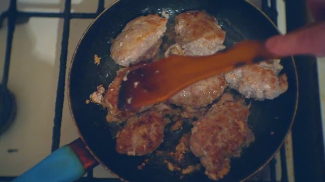 homemade cutlets from minced meat are cooked in a frying pan