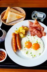 Breakfast on the table with bacon ham bread salad and egg