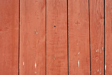 old wooden fence with red paint