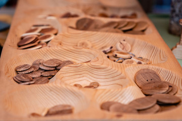 Wooden buttons and keychains in the souvenir shop.