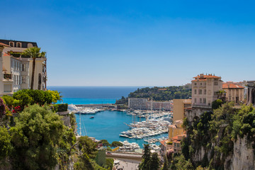 Fototapeta na wymiar View of Monaco City with boat marina below in Monaco. Monaco City is one of the four traditional quarters.