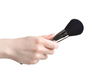 Professional make-up brush cosmetic in female hand beautician isolated on white background