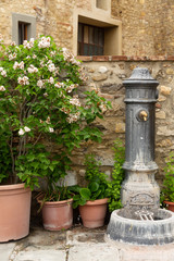 Fototapeta na wymiar Public water fountain in Barberino Val D'Elsa in Tuscany Italy