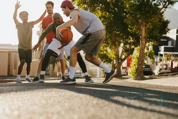 Foto op Plexiglas Men playing basketball on street © Jacob Lund