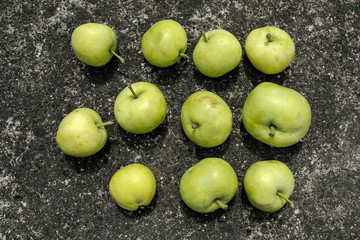 green apples on a granite background