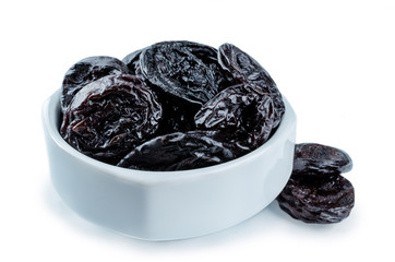 Prunes fruits in a bowl isolated