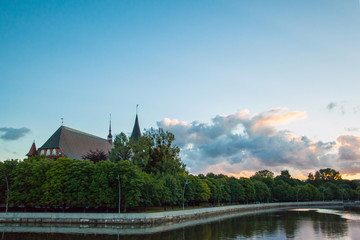 Fototapeta premium old beautiful Gothic cathedral church on the banks of the pregola river at dusk