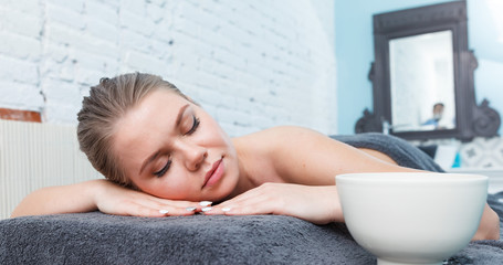 Naklejka premium Woman relaxing after massage