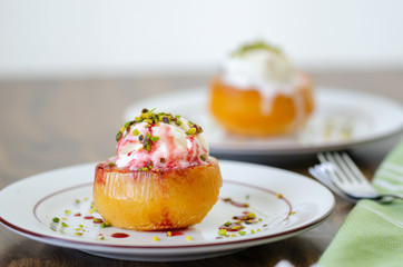 Homemade dessert served with ice cream and pistachio.