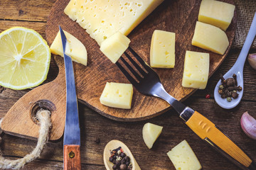 sliced cheese on a wooden board