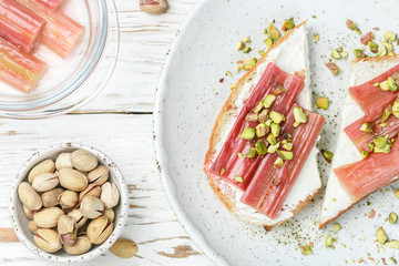Baked rhubarb. Toast with cottage cheese and pistachios. Tasty and healthy Breakfast