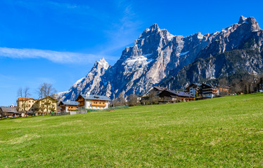 Fototapeta na wymiar Alpine Houses in the Dolomites, Italy