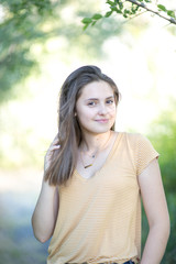 Beautiful teenage girl in a park setting