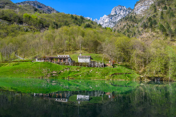 Reflection at sunset in the Mis Valley, Dolomites, Italy