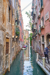 Fototapeta na wymiar Typical small canal in Venice in Italy