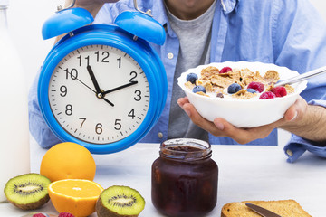 breakfast time, alarm clock and healthy and balanced breakfast
