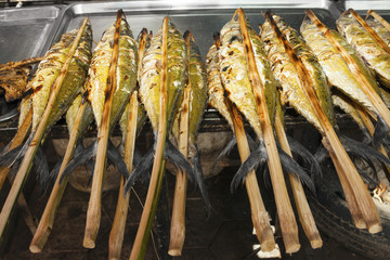 Asian street food - grilled fish - close up view.