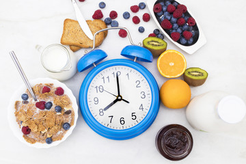 breakfast time, alarm clock and healthy and balanced breakfast
