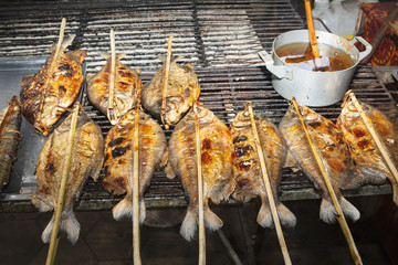 Asia street food - grilled fish - close up view.