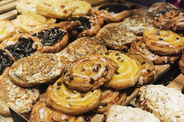 Sweet pastries, puff pastry, powdered sugar, nuts, jams, baked apples.
