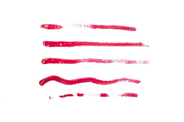 Various red strips painted with nail polish isolated on white background.