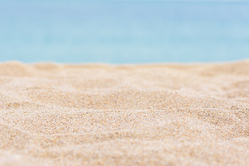 Fototapeta na wymiar sea sand and blue sea background