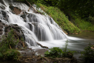 Fototapeta na wymiar A waterfall in the mountains