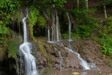 Fototapeta na wymiar a waterfall in the mounitains