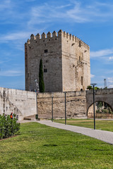 Fototapeta premium View of Calahorra Tower. Tower of Calahorra - fortress of Islamic origin conceived as an entrance and protection of the Roman Bridge of Cordoba across Guadalquivir River. Cordoba, Andalusia, Spain.