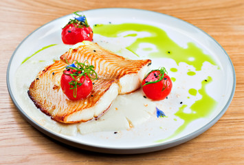 Deliciously delicate fillet of halibut with Jerusalem artichoke and tomatoes.