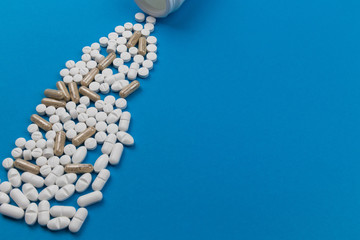 tablets and capsules on a blue background