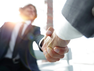 Close-up of two business people shaking hands