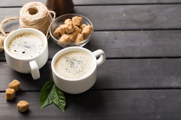 hot black coffee with cookies and beans in cafe