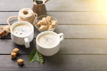 hot black coffee with cookies and beans in cafe