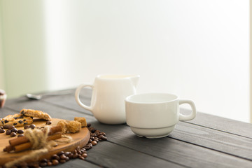 hot black coffee with cookies and beans in cafe