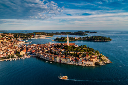 Beautiful Rovinj at sunset - HDR aerial view taken by a professional drone from above the sea. The old town of Rovinj, Istria, Croatia