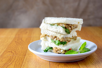 bread sandwich with tuna fish, slices on plate