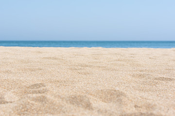 Fototapeta na wymiar sea sand and blue sea background