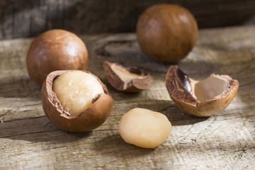 Macadamia nuts on wooden table (Macadamia integrifolia)