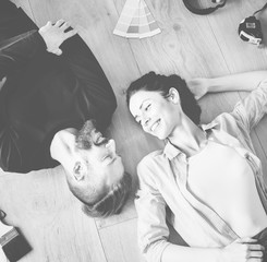 Family laying on the wooden floor