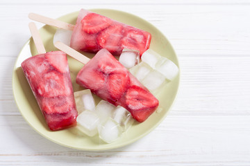Homemade popsicles with strawberry
