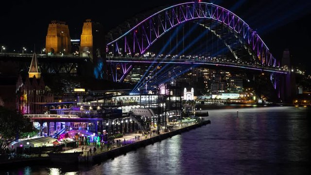 Night time lapse of Sydney Harbour in Australia during the Vivid lighting festival 2018