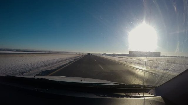 Timelapse from windshield on flat winter highway